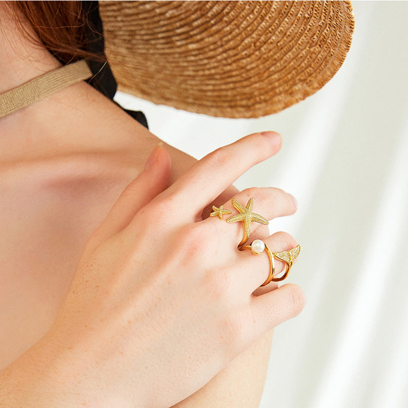 Anillo ajustable estrella de mar en plata y oro