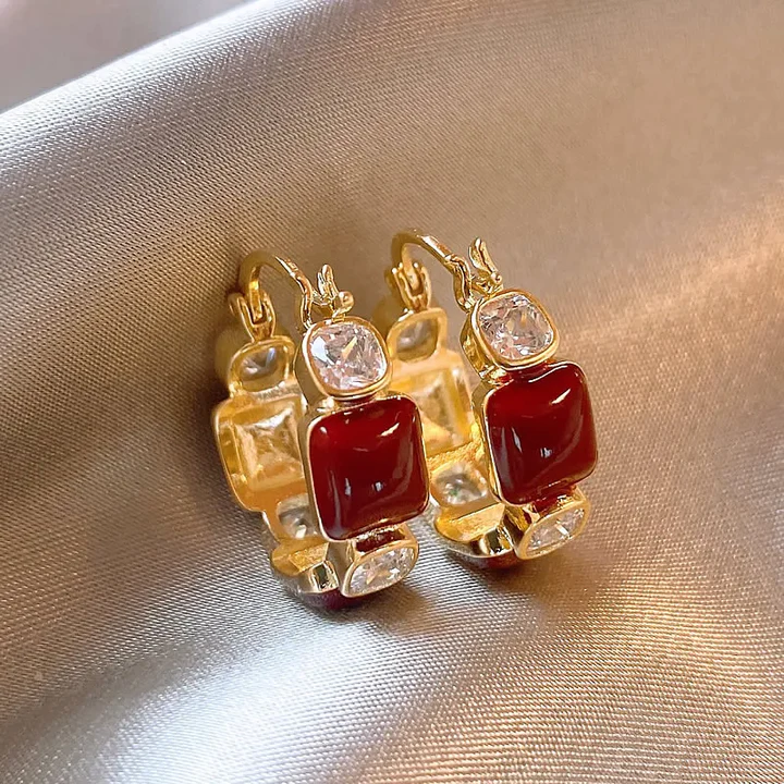Pendientes elegantes de circonitas rojas