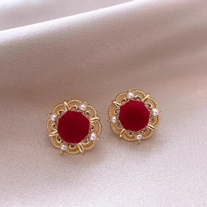 Pendientes redondos elegantes de oro rosa