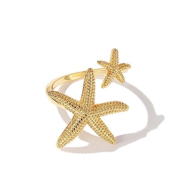 Anillo ajustable estrella de mar en plata y oro