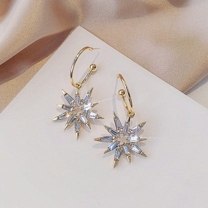 Pendientes estrella en oro y plata