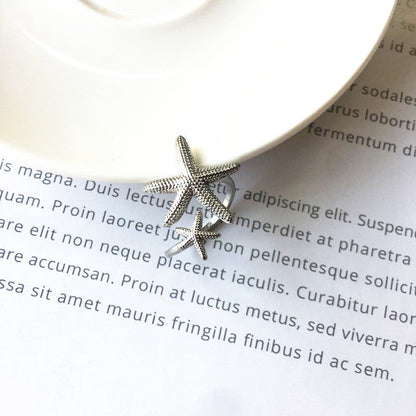 Anillo ajustable estrella de mar en plata y oro