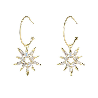 Pendientes estrella en oro y plata