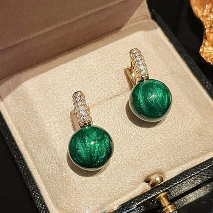 Pendientes de perlas verdes en oro