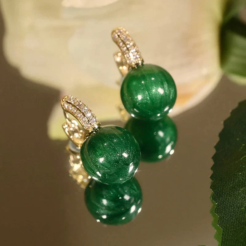 Pendientes de perlas verdes en oro