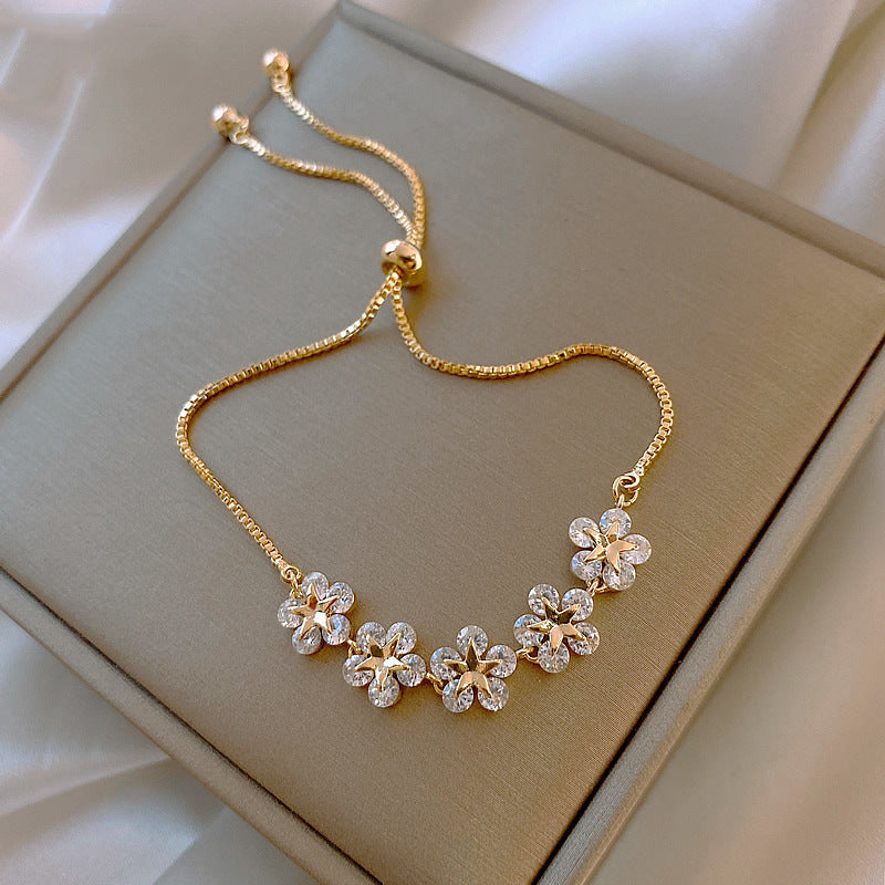 Pulsera margaritas de cristal en oro