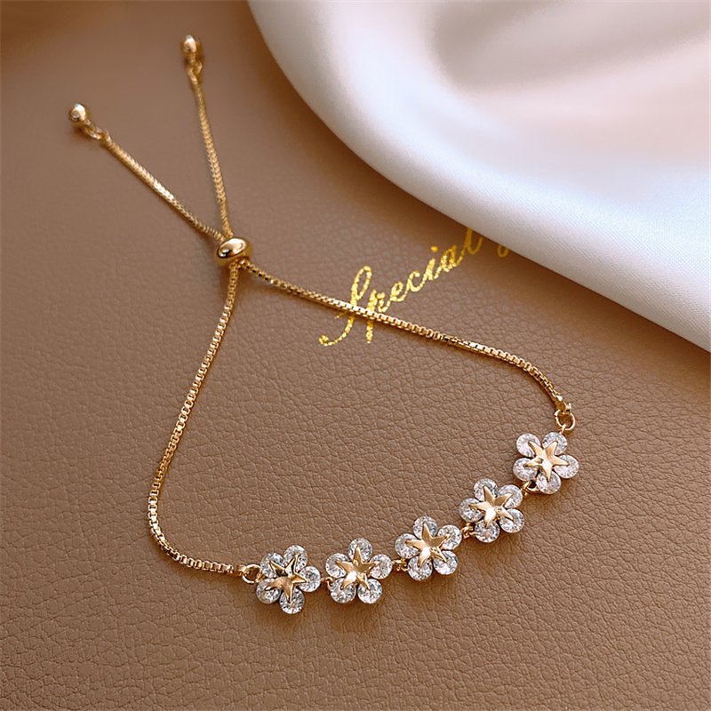 Pulsera margaritas de cristal en oro